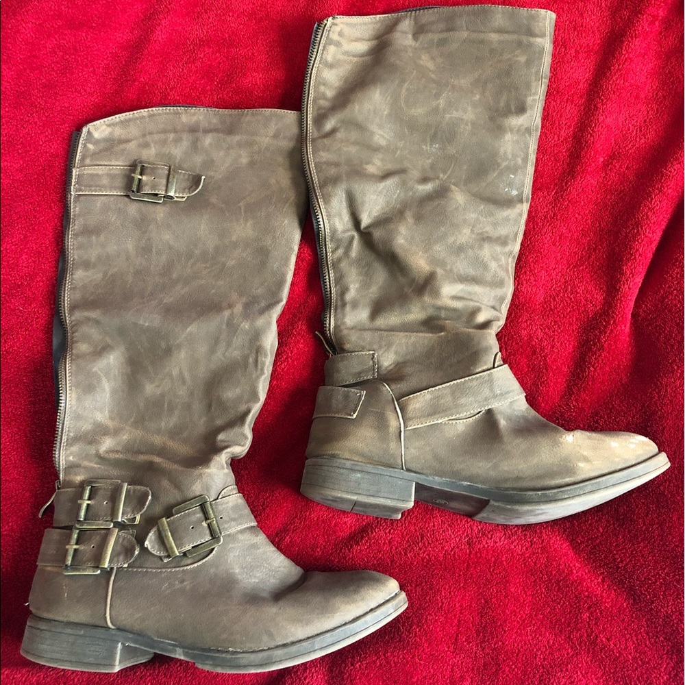 Knee high tan boots.